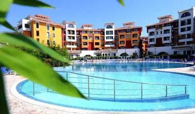 a large swimming pool in a city with buildings at Аpartments Comfort -Marina Cape in Aheloy