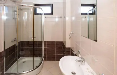 a bathroom with a shower and a toilet and a sink at Seaside Apartment with 2 Bedrooms for up to 5 Guests in Sunny Beach