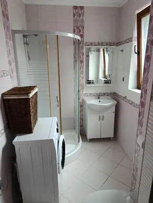 a bathroom with a shower and a sink at Family Hotel Lalov Egrek in Lozenets