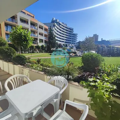 a table and chairs on the balcony of a building at TRAKIA PLAZA Apartments in Sunny Beach