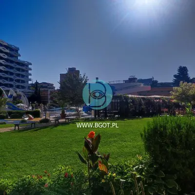 a park with a sign in the grass at TRAKIA PLAZA Apartments in Sunny Beach