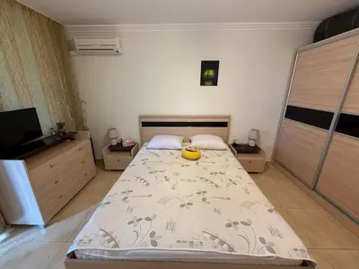 a bedroom with a bed with a banana on it at Manastira-2 (A-3) in Sveti Vlas