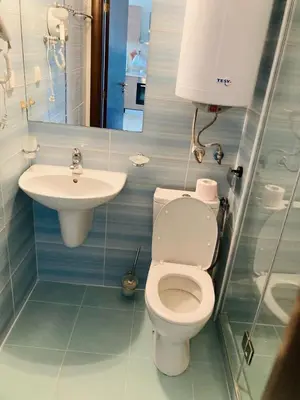 a bathroom with a toilet and a sink at Manastira-2 (A-3) in Sveti Vlas