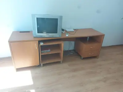a wooden desk with a television on top of it at Studio and 1bedroom apartment Burgas - Economy in Burgas City