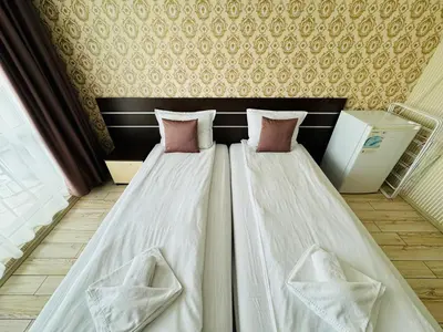 two beds sitting next to each other in a room at PARADISO B 208 Private Sea View Studio NESSEBAR in Nesebar