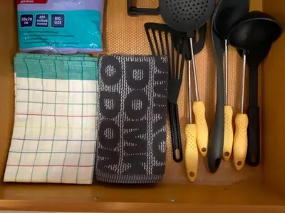 a rack of kitchen utensils hanging on a wall at ANITA A 25 Apartment Pool View SUNNY BEACH in Sunny Beach
