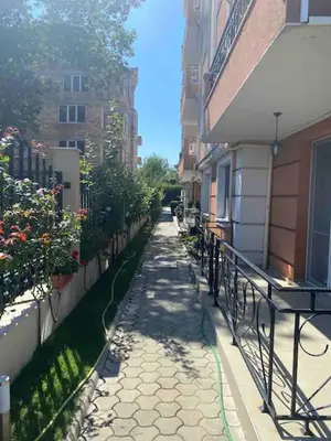 an empty alley in a city with buildings at Pomorie residence 2-bedroom apartment 300m to the beach in Pomorie