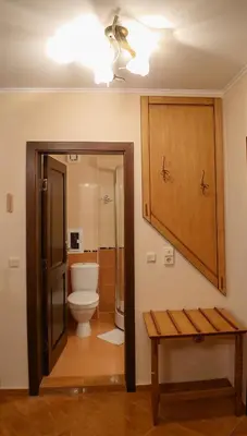 a bathroom with a toilet and a sink at Helios 350m from the beach in Sveti Vlas
