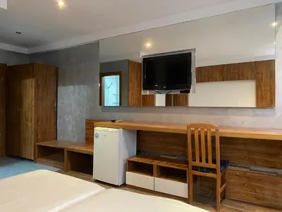 a kitchen with a counter and a tv on the wall at SAPPHIRE 202 Studio Sunny Beach in Sunny Beach