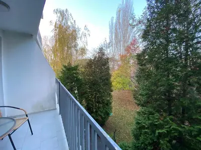a balcony with a view of a yard with trees at SAPPHIRE 202 Studio Sunny Beach in Sunny Beach