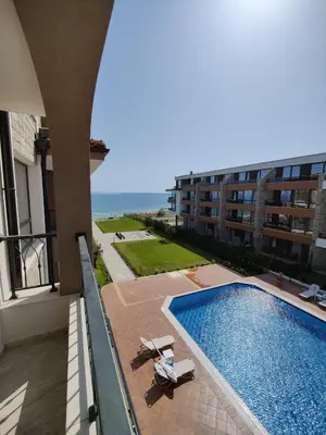 a view of a swimming pool in a building at BBR26- Sea View First Line Apartment Sarafovo in Burgas City