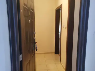 an open door to a hallway with a tile floor at Уютно и просторно студио in Ravda