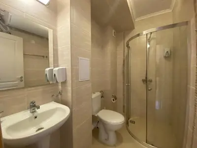 a bathroom with a toilet and a sink and a shower at MESSEMBRIA B504 Studio Sunny Beach in Sunny Beach