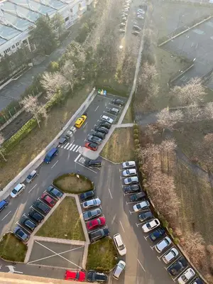 an aerial view of a parking lot with parked cars at City view in Residences in Burgas City