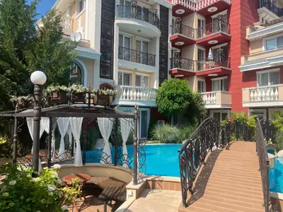 a stairway leading up to a building with a pool at MESSEMBRIA A309 Studio Sunny Beach in Sunny Beach