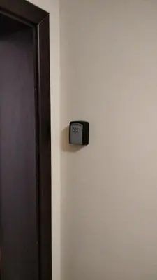 a clock on a wall next to a door at Victoria's apartments Nesebar in Nesebar