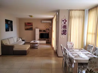 a living room with a couch and a table at Victoria's apartments Nesebar in Nesebar