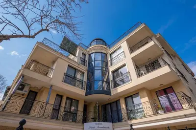 a building with balconies on the side of it at Minimalistic 1BR flat with a Parking spot in Varna City