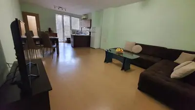 a living room with a couch and a table at Minimalistic 1BR flat with a Parking spot in Varna City