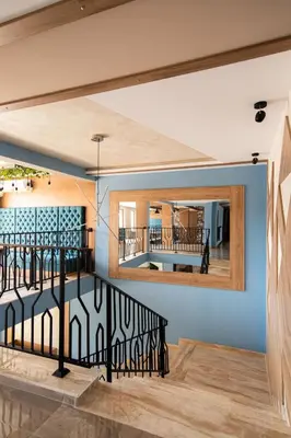 a staircase in a house with a mirror at Sea Dreams Apartment in Sveti Vlas