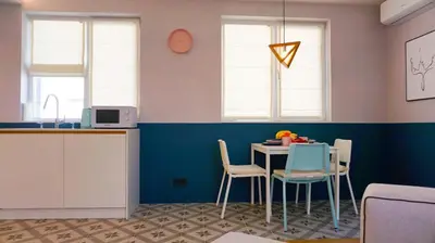 a kitchen with a table and chairs in a room at Апартамент Жасмин с частен гараж - Jasmin Apartment with private garage in Varna City