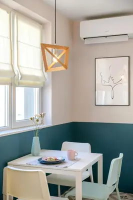 a dining room with a white table and chairs at Апартамент Жасмин с частен гараж - Jasmin Apartment with private garage in Varna City