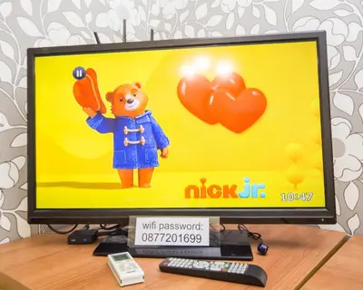 a computer monitor with a toy on top of it at Best Price - Downtown Flat in Burgas City