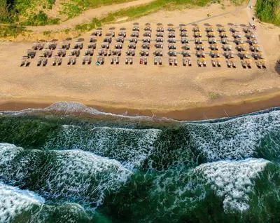 an aerial view of a beach with chairs and the ocean at Marina Sands Bijou Boutique - Amazing views in Obzor