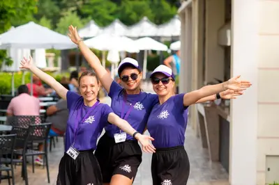 three women in purple shirts posing for a picture at Marina Sands Bijou Boutique - Amazing views in Obzor