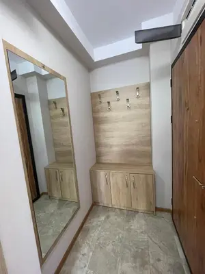 a bathroom with a large mirror and a walk in shower at Marea Garden apartments in Ravda