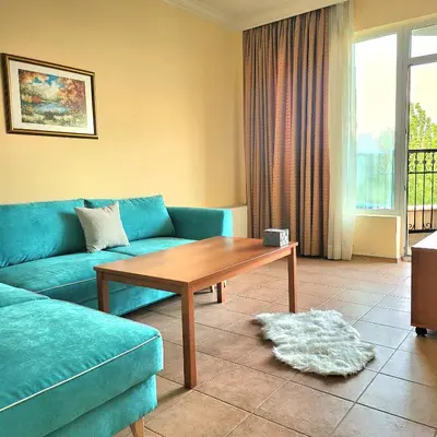 a living room with a blue couch and a coffee table at 
