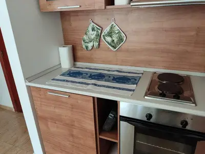 a kitchen with a stove and a counter top at Dean's Cozy 2 Bed Apart at Sunny Beach resort in Sunny Beach