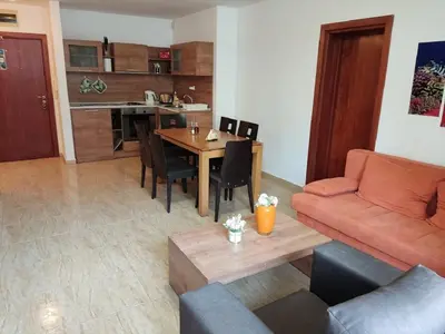 a living room with a couch and a table at Dean's Cozy 2 Bed Apart at Sunny Beach resort in Sunny Beach