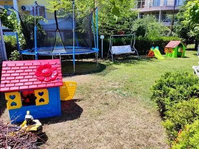 a yard with a playground with a play equipment at Dean's Cozy 2 Bed Apart at Sunny Beach resort in Sunny Beach
