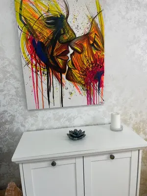 a painting on a wall above a white cabinet at Felicity Super Central Apartment in Burgas City