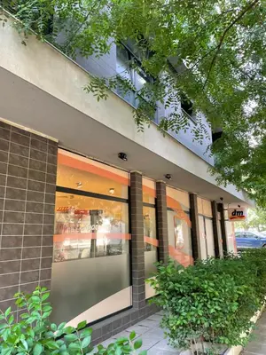 a store front of a building with large windows at Felicity Super Central Apartment in Burgas City