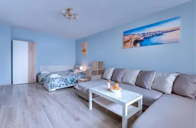 a living room with a couch and a table at Daisy - 3 Room and kitchen apartment in Lazur in Burgas City