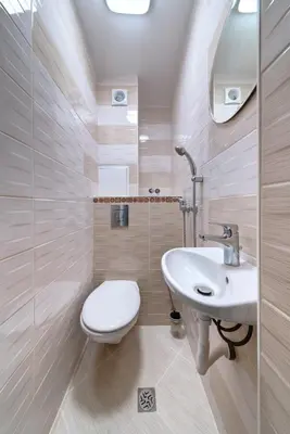 a bathroom with a toilet and a sink at Daisy - 3 Room and kitchen apartment in Lazur in Burgas City