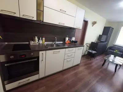 a kitchen with a sink and a stove top oven at Двустаен апартамент в центъра на гр. Бургас in Burgas City