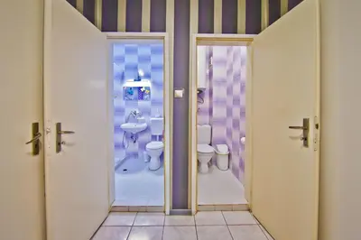 a bathroom with a toilet and a sink at Perla 2-bdrm in the heart of the city in Varna City