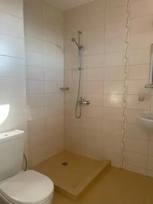 a bathroom with a shower and a toilet and a sink at Villa Mia in Sozopol