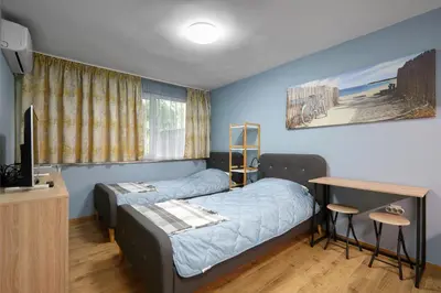 a bedroom with a bed and a desk and a television at Top Center, Sea Garden, Brand New Studio - Majestic in Burgas City