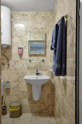 a bathroom with a sink and a mirror at Top Center, Sea Garden, Brand New Studio - Majestic in Burgas City