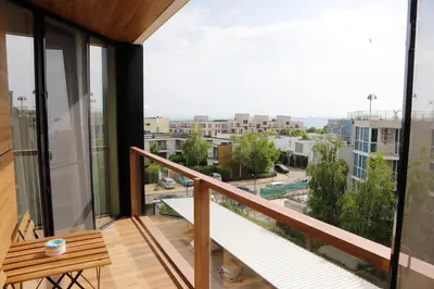 a balcony with a view of a city at Casa Maiolica in Atlantis Atmosphere in Burgas City