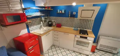 a small kitchen with a red refrigerator and a microwave at Brand studio in Varna City