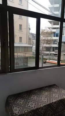 a room with a window looking out at a building at 27 юли 3 бюджет in Varna City