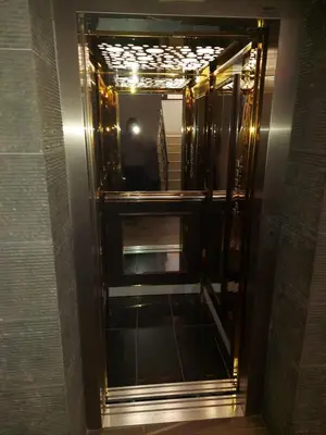 an elevator in a bathroom with a mirror at Студио Прованс Лариса in Pomorie