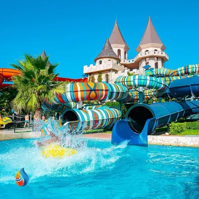 a water slide in front of a castle at Apartament with See View in Sveti Vlas