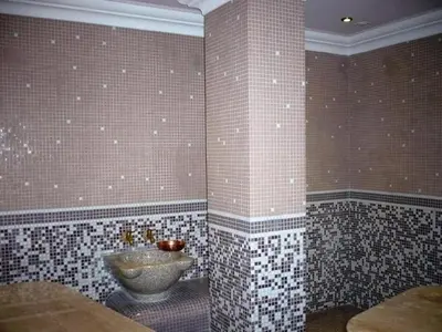 a bathroom with a sink and tiled walls at Apartament with See View in Sveti Vlas