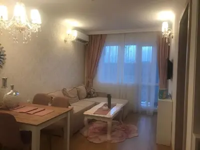 a living room with a couch and a table at Sweet Homes 6 in Sunny Beach